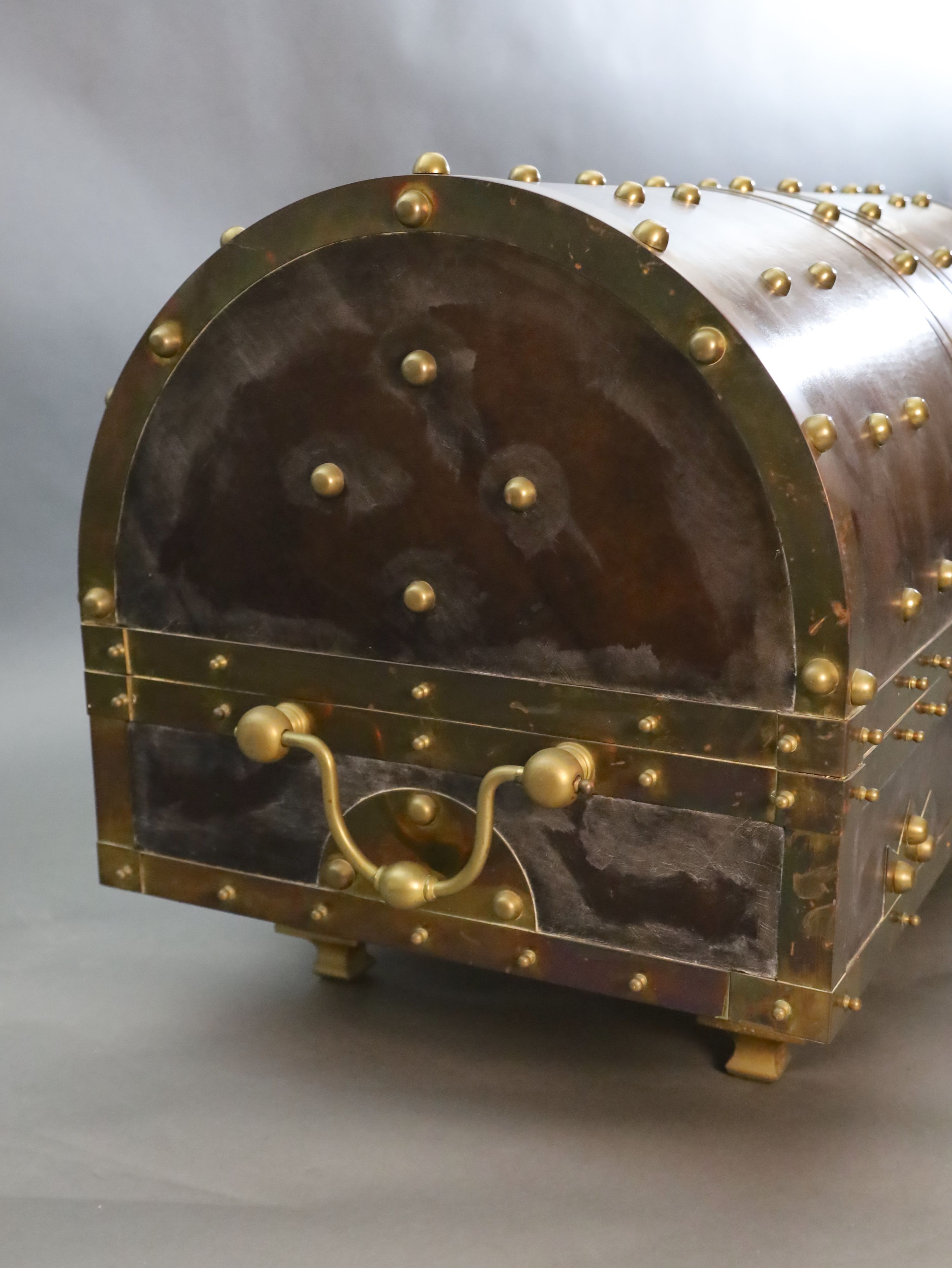 An ormolu and brass mounted leather dome top coffer,